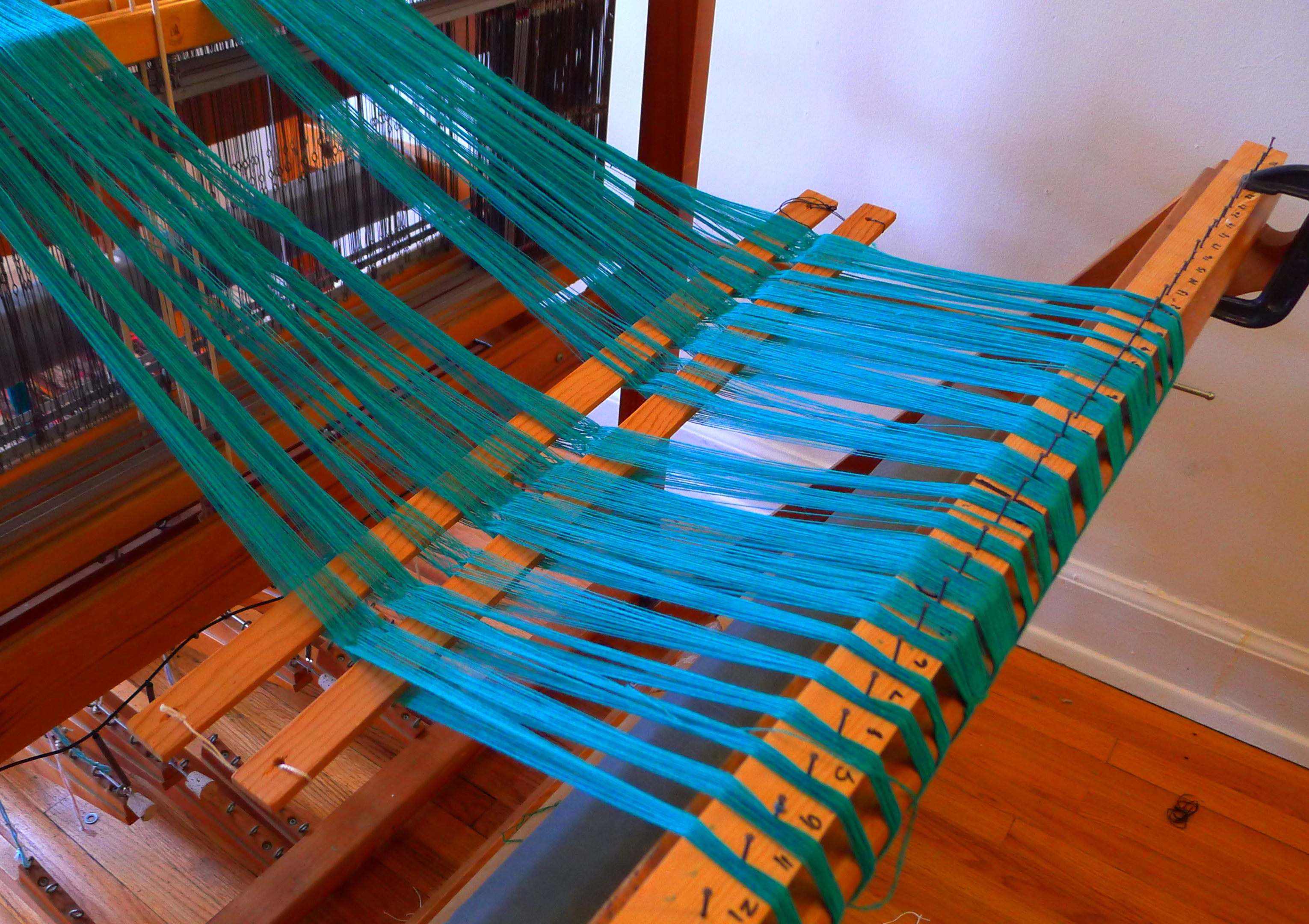 The back of the loom with the warp winding on.